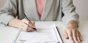 Image of a woman filling in a job application form.