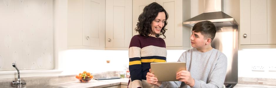 mother helping son with homework