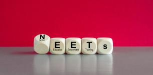 A line of blocks spelling out the word NEET.