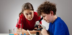 child with microscope