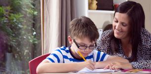 mother helping son with homework