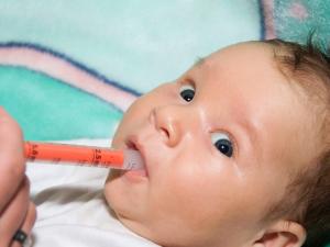 a baby receiving the rotavirus vaccine