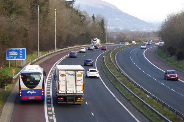 Motorway traffic showing a bus travelling in a motorway bus lane