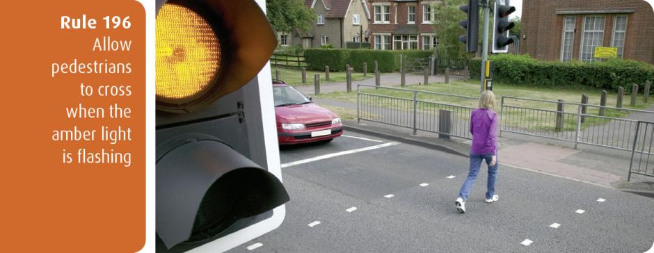 Highway Code for Northern Ireland rule 196 - allow pedestrians to cross when the amber light is flashing